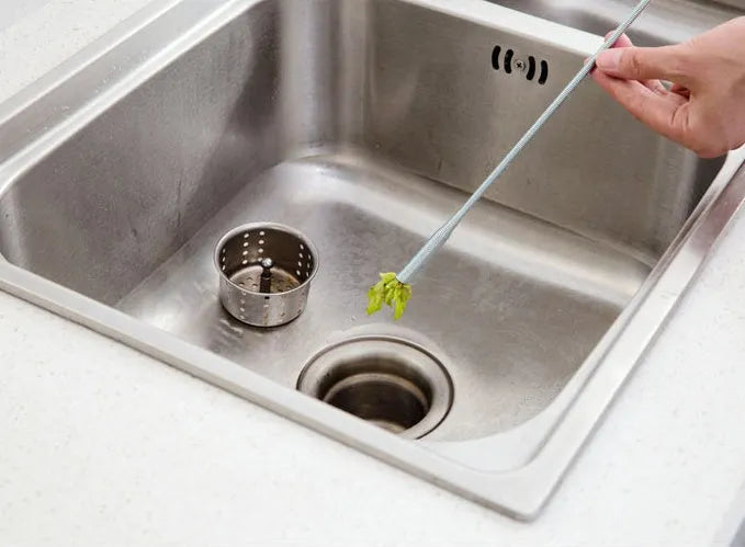 Stainless steel sewer dredge spring drain cleaning tool with a black PP handle.
