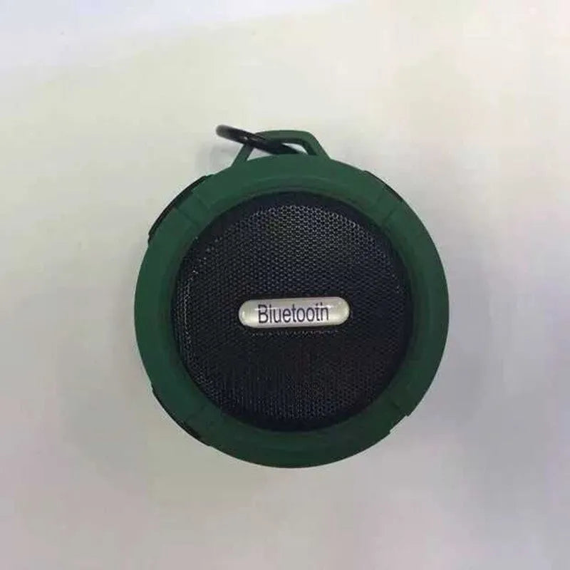 C6 portable waterproof Bluetooth speaker in multiple colours with a mounting clip attached.