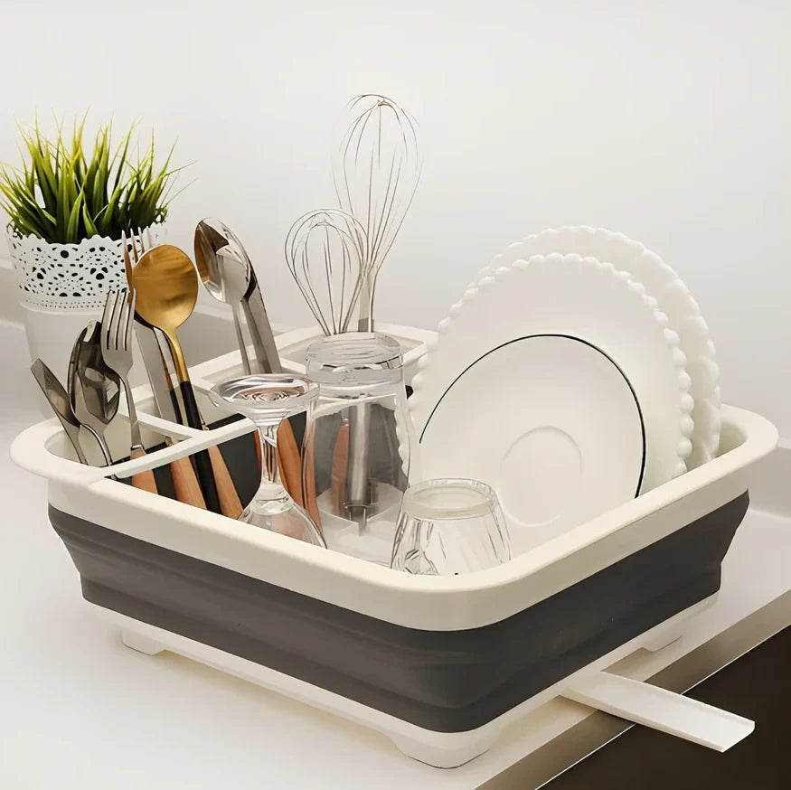 Grey folding kitchen dish rack showing collapsed flat position and separate utensil compartment