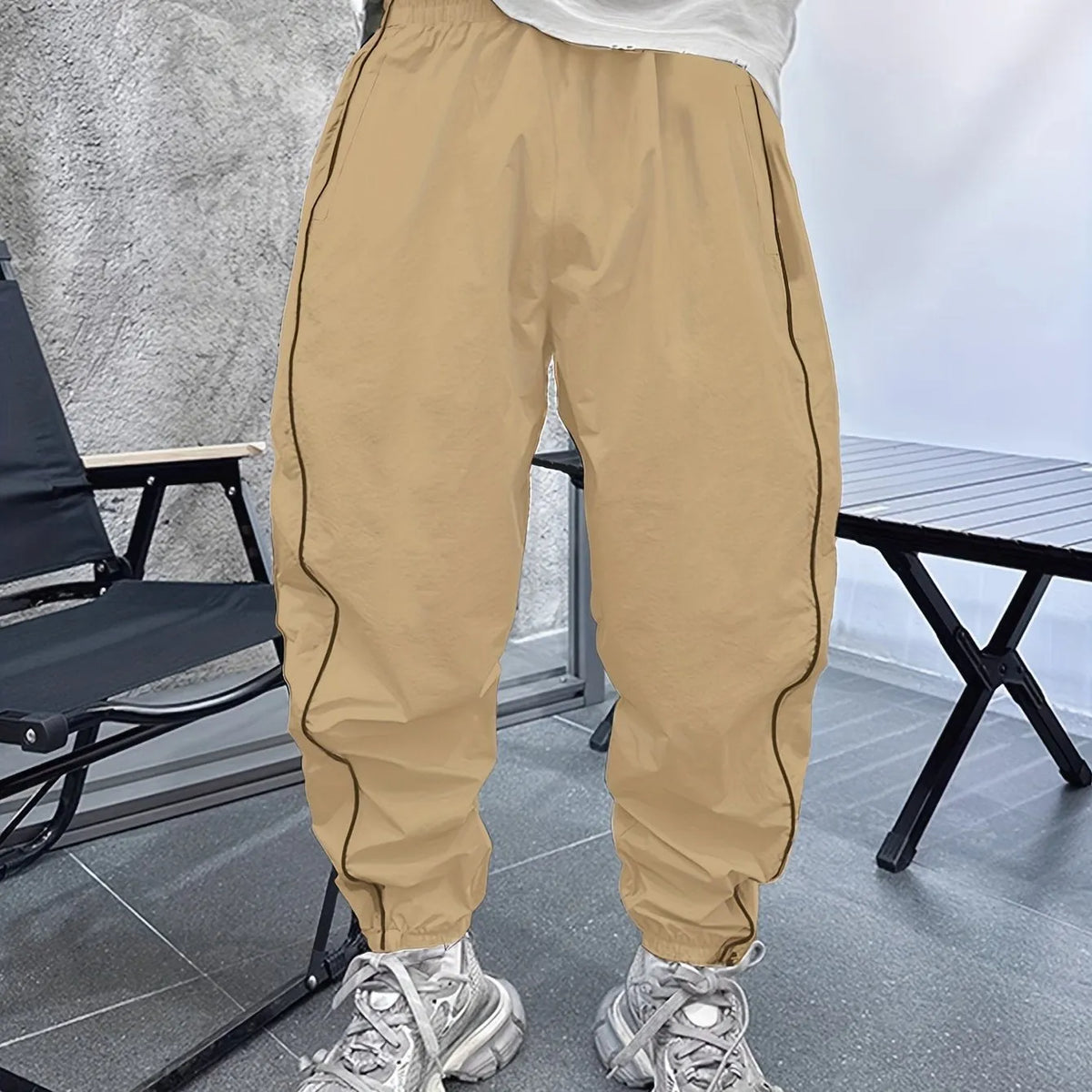 Men's bamboo fibre cropped sports trousers in army green colour showing loose fit and elastic waistband