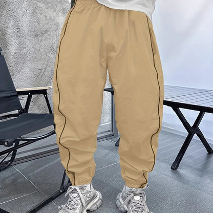 Men's bamboo fibre cropped sports trousers in army green colour showing loose fit and elastic waistband