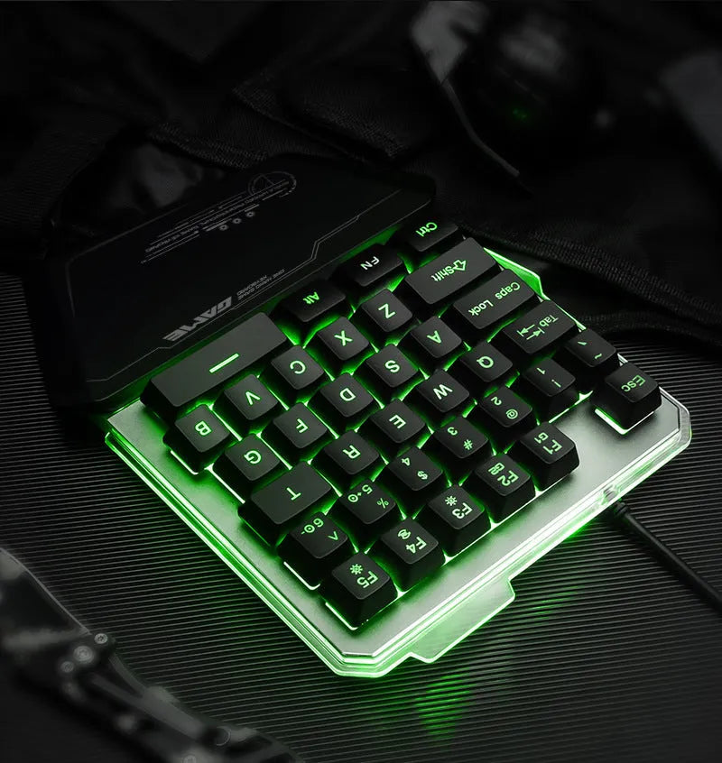 Black one-handed keyboard with RGB backlight and 1.8-metre USB cable on a desk