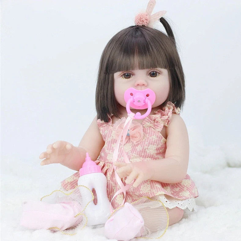 Interactive baby doll with drinking bottle showing 46cm length and 360-degree rotating limbs