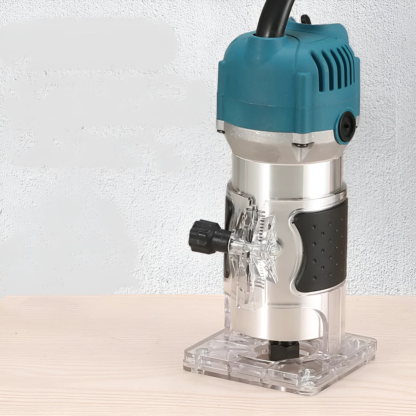 800W electric wood polishing trimmer with aluminium casing on a wooden workbench.