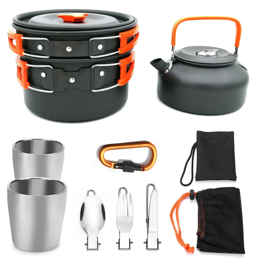 Outdoor camping cookware set with saucepan, frying pan, teapot, and stainless steel cups in mesh storage bag
