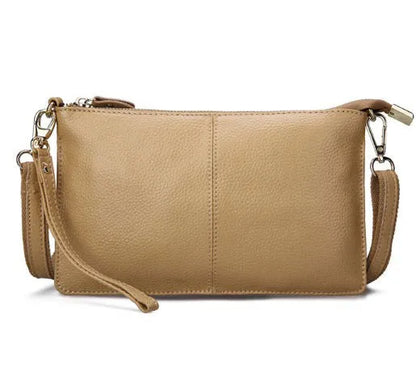 Lady's cowhide slant bag in apricot colour showing front view with strap and compact 24 cm size.