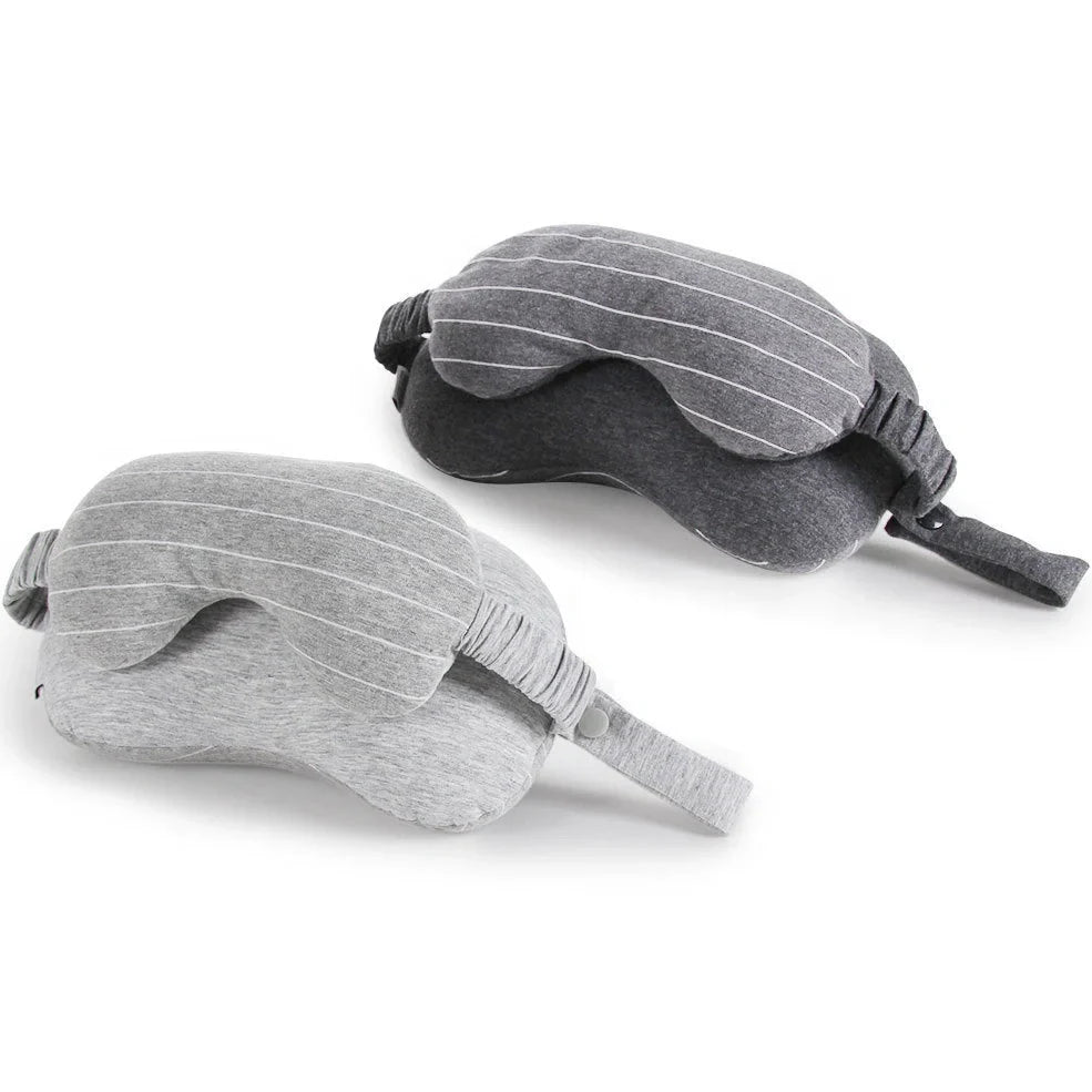 Dark grey two-in-one pillow showing neck support position and eye mask function with 24cm length measurement