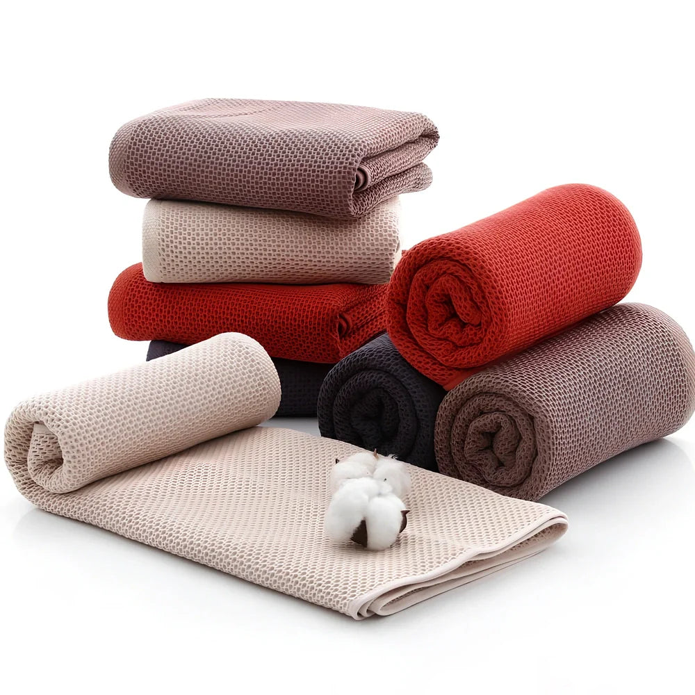 100% cotton honeycomb weave face towel in blue colour showing textured pattern and 70x140cm dimensions