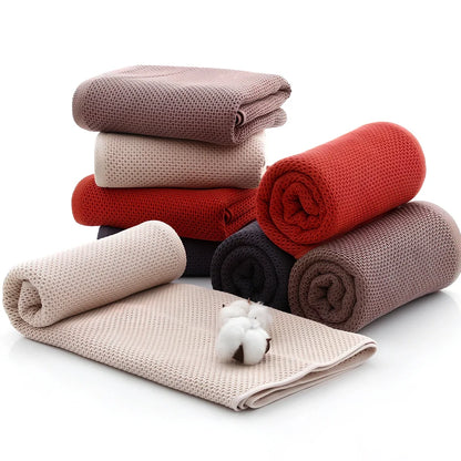 100% cotton honeycomb weave face towel in blue colour showing textured pattern and 70x140cm dimensions