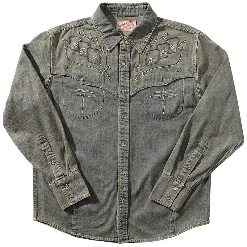 Aqua blue washed denim shirt with geometric embroidery and cardigan style front.