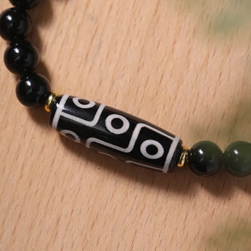 Obsidian agate dzi bead Tibetan bracelet with ethnic pattern on wrist