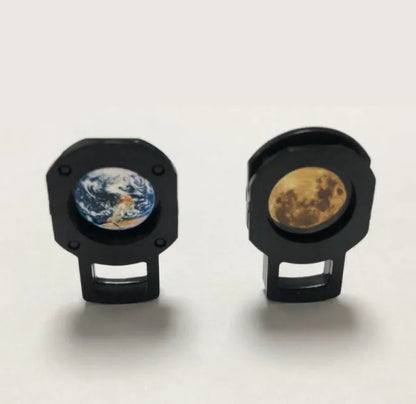 A star projector lamp showing an earth projection on a wall, with its flexible hose bracket allowing adjustable angles.