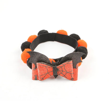 Halloween fur ball pet collar with pumpkin, pirate, witch and skull designs in six colour options