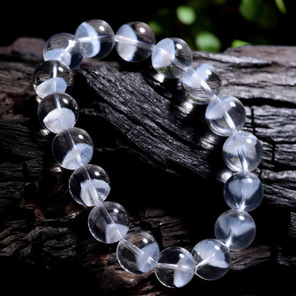 Women's original design bracelet with white crystal ghost pyramid beads and a ruyi decorative element.