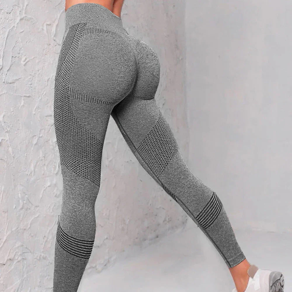 Women's high-waist seamless leggings in a variety of vibrant colors, featuring a curve-flattering design and breathable nylon fabric