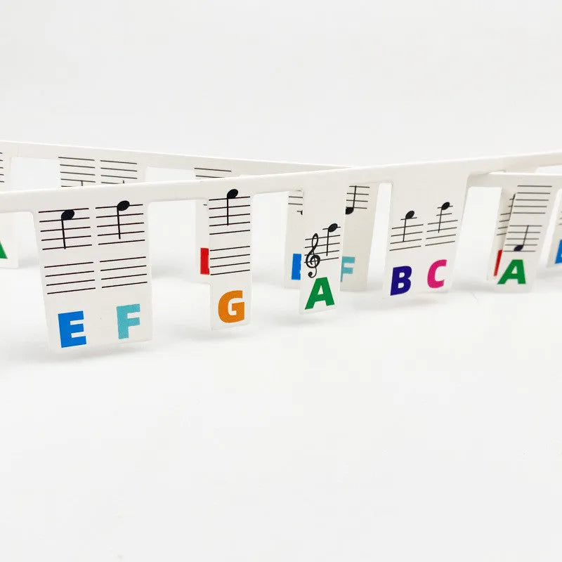 Piano keyboard stickers for 88 key pianos featuring removable white card staff notation with colour note bars and black note markers in separate opp bags for easy learning and practice visual aids