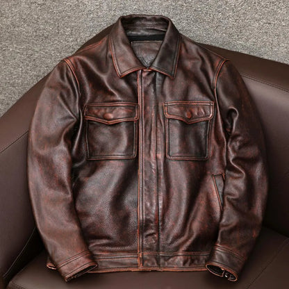 Man's black loose fit lapel PU leather jacket with a side seam pocket on a hanger.
