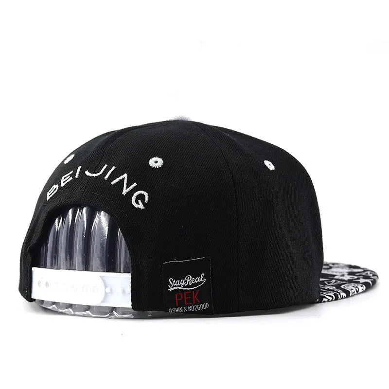 Cotton baseball hat with letter embroidery showing dome crown and adjustable strap in black and white colour options