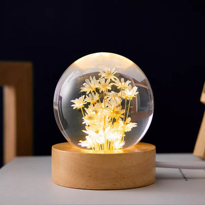 LED Dandelion Crystal Ball Night Light with oak base emitting soft glow
