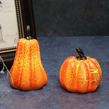 Set of three resin Halloween pumpkin lanterns with LED lights in long, medium, and short sizes.