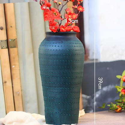 Ceramic mosaic vase with dried flowers, showing mosaic pattern and 25cm height