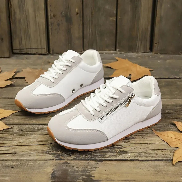 Women's flat-heeled shoe in champagne colour with artificial PU upper and rubber sole.
