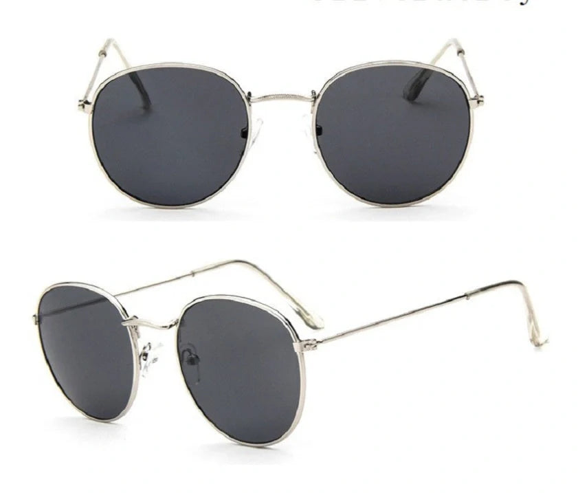 Stylish women's retro sunglasses with round frame and metal finish