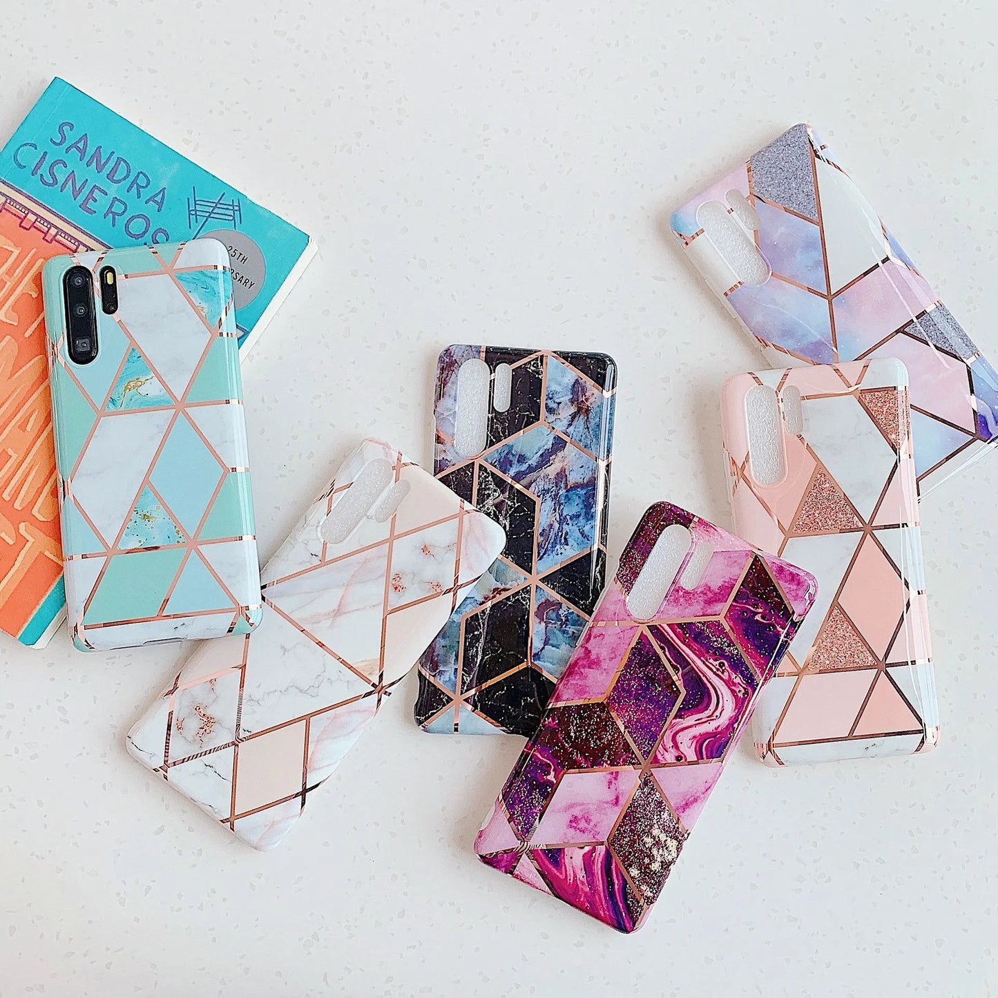 Electroplated marble mobile phone case in various colours for Huawei and Samsung models, showing slim TPU back cover design