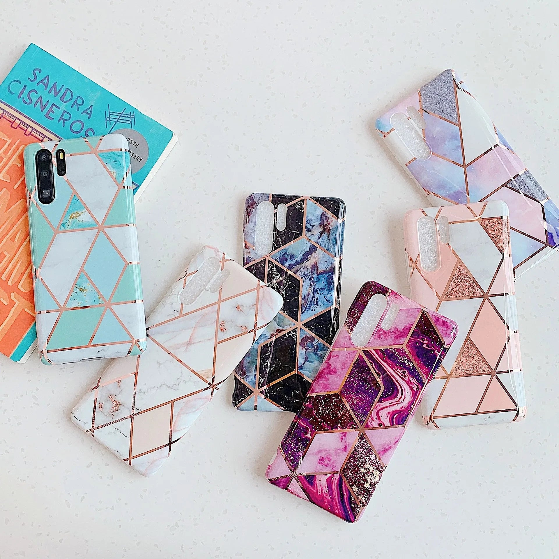 Electroplated marble mobile phone case in various colours for Huawei and Samsung models, showing slim TPU back cover design