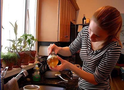 Transparent kitchen honey dispenser showing 200ml capacity with measurements 8.3x10x15cm