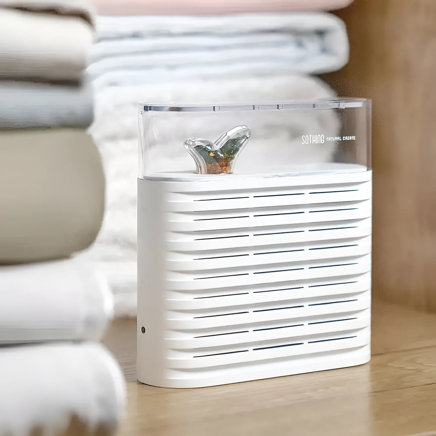 White recyclable cabinet dehumidifier box with transparent top showing colour-changing moisture beads