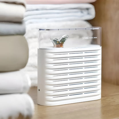 White recyclable cabinet dehumidifier box with transparent top showing colour-changing moisture beads