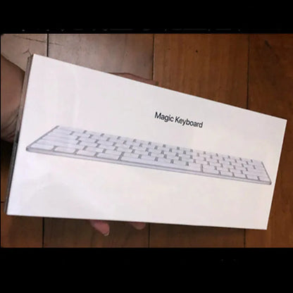 White Apple G6 ultra-thin metal Bluetooth wireless keyboard on a desk