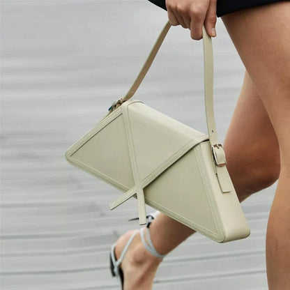 Stitching contrast trapezoid shoulder bag in black, beige, blue, and orange with magnetic buckle closure