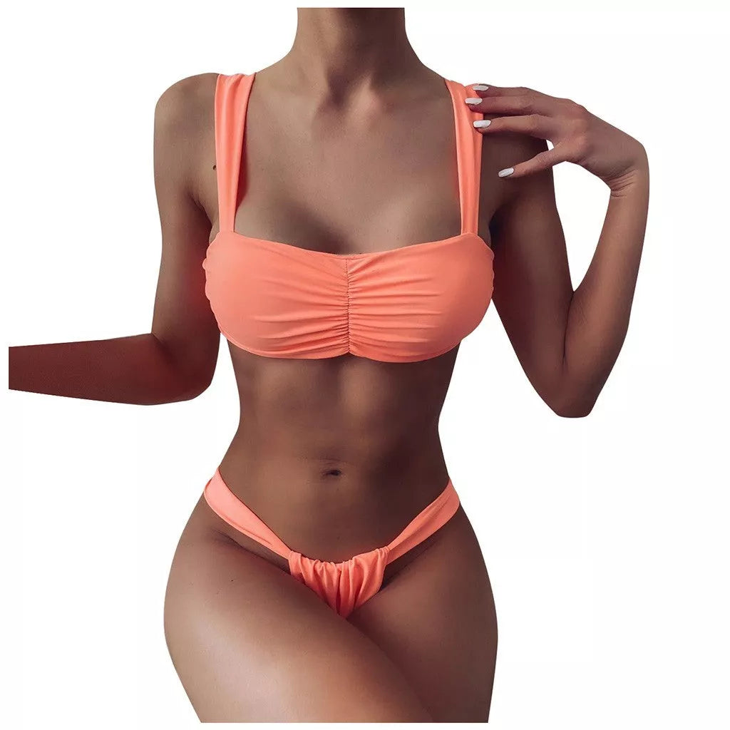 Solid color split bikini swimsuit in orange with nylon fabric and polyester lining