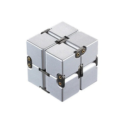 Zinc alloy Infinity Cube with eight rotating cubes showing black and silver colour options on wooden surface
