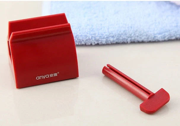 Versatile toothpaste dispenser made of durable ABS plastic for effortless product extrusion and bathroom organization