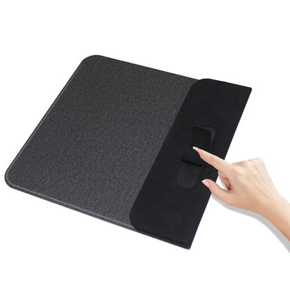 Foldable cloth wireless phone holder charging a smartphone, showing compact storage design