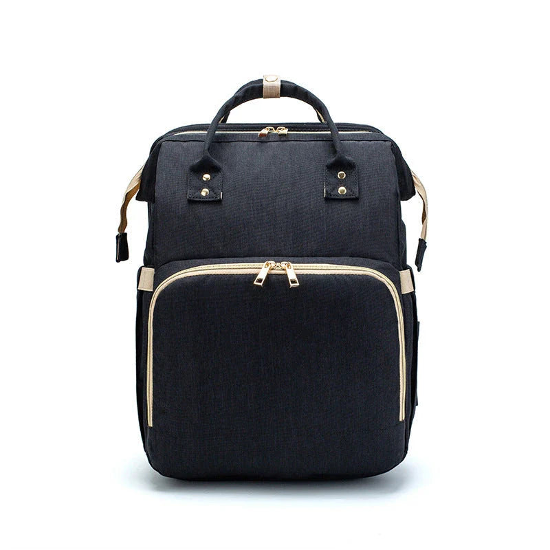 Versatile baby changing backpack with USB charging port and folding portable bed