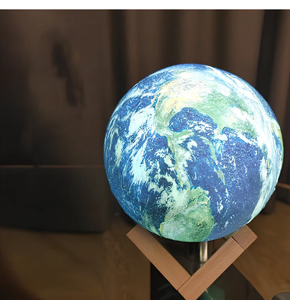 3D printed Earth lamp showing mountain topography with LED illumination through PVC material