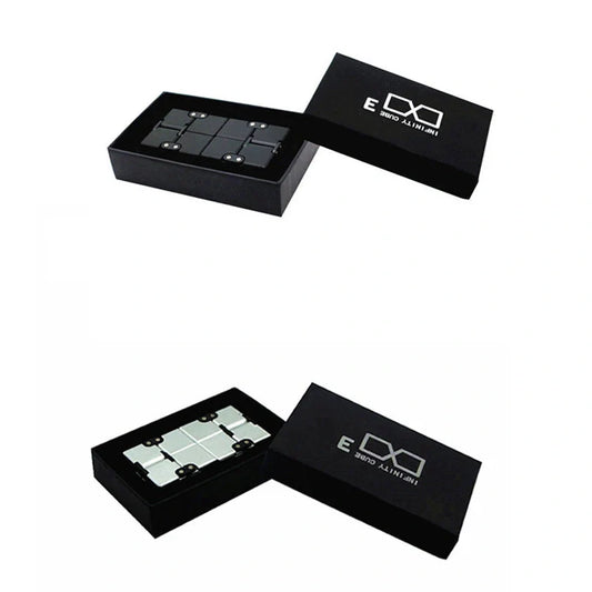 Zinc alloy Infinity Cube with eight rotating cubes showing black and silver colour options on wooden surface