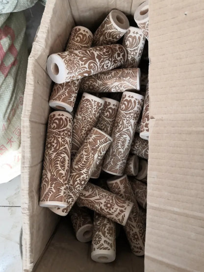 Wooden rolling pin with engraved Christmas patterns including reindeer and snowflakes on a 45cm long barrel.