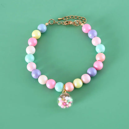 Adjustable resin pet collar with macaron designs in six colours, showing sizing from 15-38cm