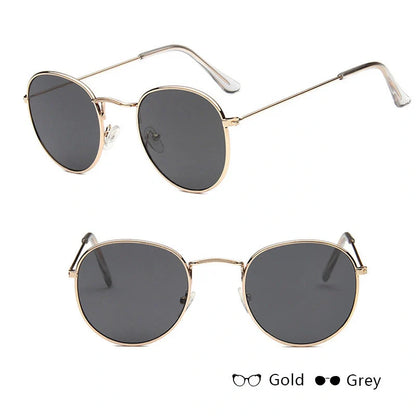 Stylish women's retro sunglasses with round frame and metal finish