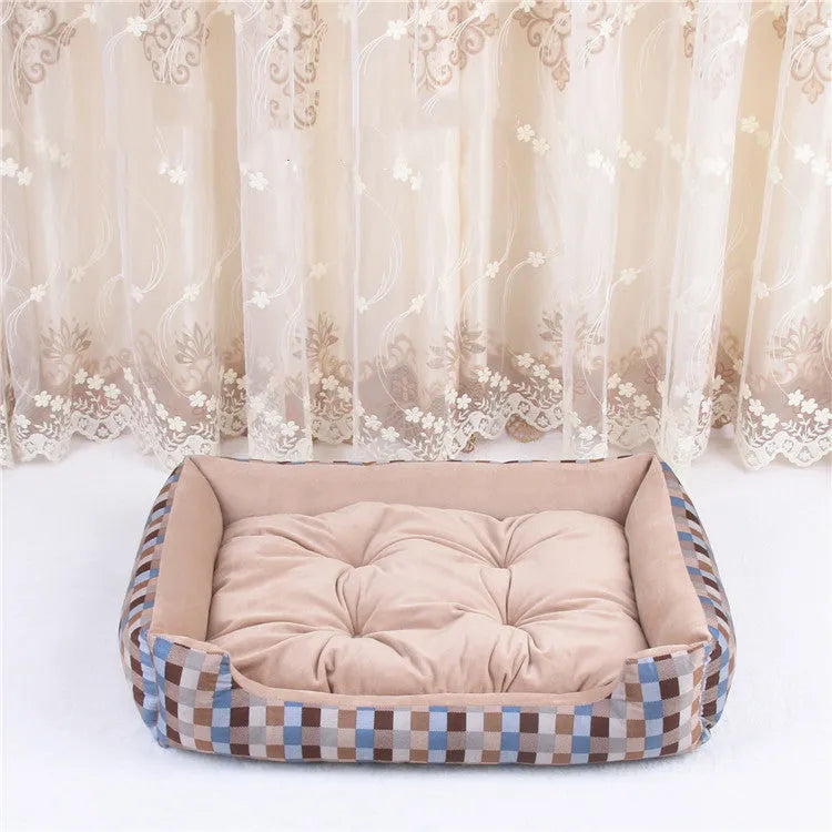 Oval cloth pet bed for dogs or cats in a striped colour pattern, showing its soft cushion shape.