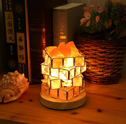Himalayan salt lamp with wooden base and dimmable switch showing pink and orange salt rocks