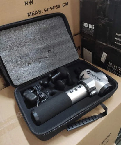 Black and white percussion muscle massager gun with ergonomic handle on a grey background.