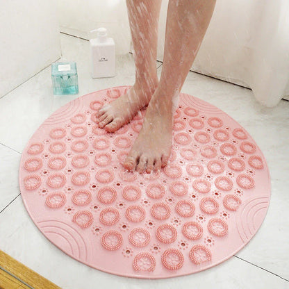 Textured round shower mat with anti-slip surface, massage nodules, and drainage holes for a comfortable and safe bathing experience