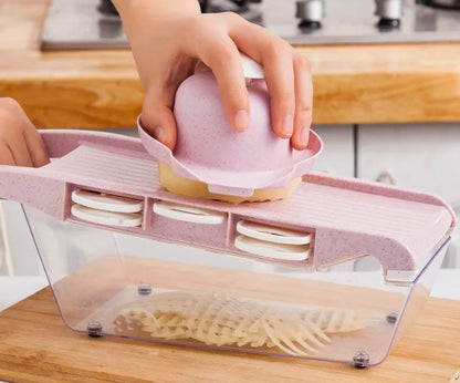 Multifunctional vegetable cutter with seven stainless steel blades on a food-grade plastic body.