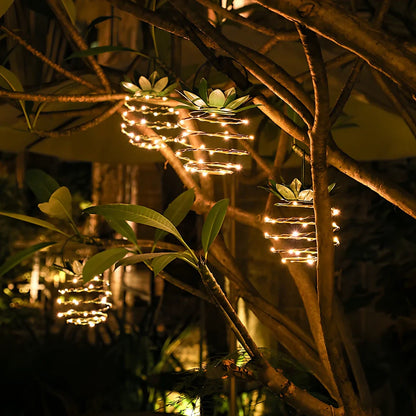 Pineapple-shaped solar garden light with LED illumination and waterproof housing for outdoor use